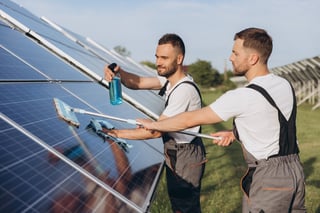 Labor working on cleaning solar panel at solar power plant, Professional cleaning, Solar panels.